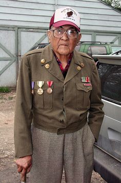 Joseph Medicine Crow wearing his military medals